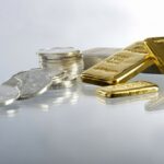 silver coins and gold bars